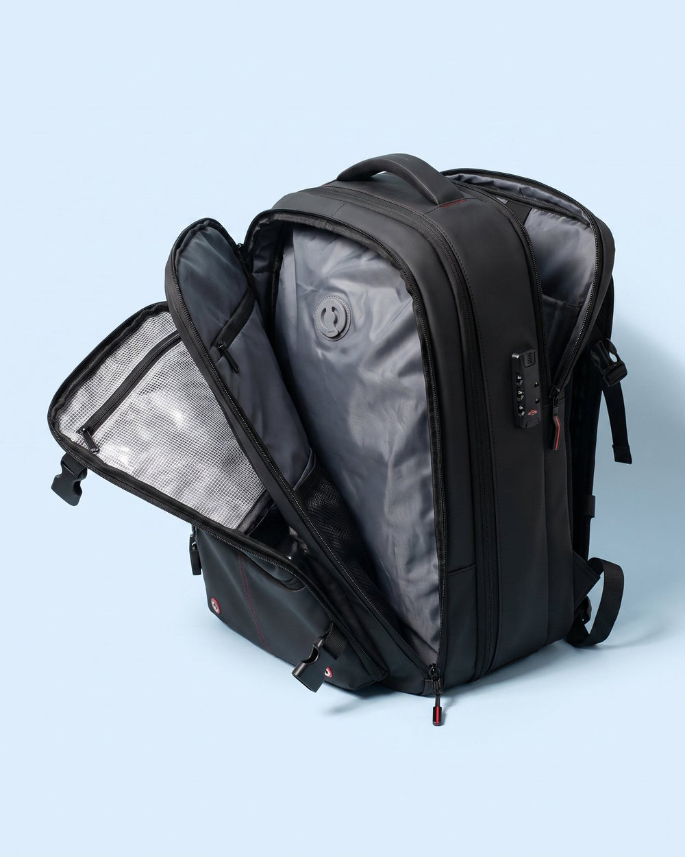 The Atlas opened flat, showing the compression liner, its one-way valve and the mesh lid pockets